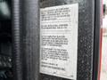 A label on a 2009 Spartan Gladiator chassis cab details compliance with federal safety standards and instructions for completion of vehicle documentation