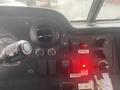 Close-up of the dashboard controls in a 2012 Ford Econoline featuring dials switches and indicator lights