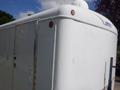 2004 Royal 18 Foot Office Trailer with a white exterior features a rounded roof and a single door on the side