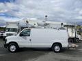 A white 2008 Ford Econoline van equipped with a hydraulic lift and rear platform for transporting tools or equipment
