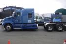 A blue 2015 Kenworth T660 truck is shown in profile with an extended cab and dual rear wheels