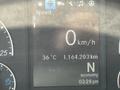 Dashboard display of a 2022 Freightliner Cascadia showing speed at 0 km/h temperature at 36°C total distance of 1,164,203 km and current gear indicator in economy mode