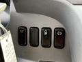 Control panel featuring four buttons for various functions in a 2015 Mitsubishi Fuso FE