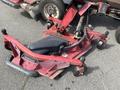 A 2014 Toro Groundmaster 5910 mower deck with a black engine cover and red framework featuring wheels and hydraulic connections