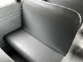 Interior of a 2015 Spartan School Bus featuring a single gray vinyl seat visible in the foreground