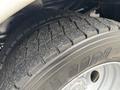 Close-up of a treaded tire from a 2018 Ford F-550 showing detailed patterns for traction and grip