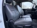 The interior of a 2018 RAM 5500 featuring two spacious gray leather front seats designed for comfort and durability
