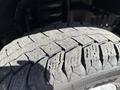 Close-up of a tire from a 2021 Ford Econoline showing detailed tread patterns and texture on the rubber surface