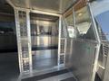 Interior of a 2007 Chevrolet Express van featuring metal cages and dividers with a flat floor and a metal structure
