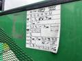 A green equipment label showing diagrams and instructions for a Sky Trak Legacy Series lift with various icons representing different features and functions