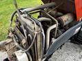 A close-up view of the engine compartment of a 2018 Kubota B2650 showing various mechanical components including tubes and a radiator