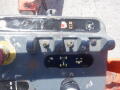 Control panel of a 2008 JLG Boom Lift featuring various switches and indicators for operation and safety