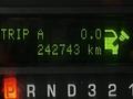 Dashboard display of a 2009 Ford Econoline showing trip data with a total distance of 242743 km and a trip reset indicator