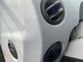 Close-up of the control panel of a 2016 New Holland T475 featuring air vents and textured surface