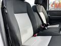 Two front seats of a 2010 Ford Ranger with black and gray upholstery