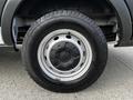 Close-up of a 2020 Ford Transit tire and wheel showing a black tire with tread and a silver wheel rim