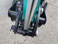 Close-up of the hydraulic arm and attachment mechanism of a 2024 AGT Industrial Green QH13R Mini Excavator