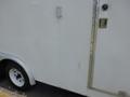 2004 Royal 18 Foot Office Trailer with a white exterior and a metal door handle visible on the side
