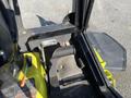 A close-up view of the foot controls and floor area of a 2010 Kubota F3990 with a yellow and black design