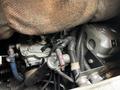 Close-up of the engine compartment of a 1991 Sutphen Deluge showcasing various mechanical components and hoses