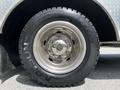 Close-up of a tire from a 2009 Ford F-550 showing a shiny wheel and a rugged tire tread designed for heavy-duty performance