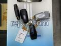 A set of 2022 Ford Transit keys with multiple key fobs and a key tag attached