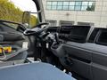 Interior of a 2015 Mitsubishi Fuso FE showing the steering wheel dashboard and controls
