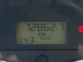 A digital display showing 72862.7 KM and 14.3 VOLTS on a 2011 Freightliner M2 106 dashboard