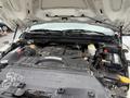 Engine bay of a 2011 Dodge Ram 5500 showing various components including the engine battery and fluids