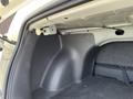 Interior view of the trunk space in a 2005 Chrysler PT Cruiser showing the sides and storage area