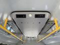 Interior ceiling of a 2019 Chevrolet Express featuring overhead lights and air vents with yellow grab rails on the sides