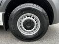 Close-up of a wheel and tire on a 2020 Mercedes-Benz Sprinter showing a silver rim with ventilation holes and a black tire with tread markings