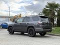 A gray 2021 Toyota 4Runner with black rims parked at an angle showcasing its robust design and features