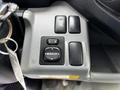 Controls for adjusting mirrors in a 2018 Hino 195 including buttons for left right and mirror adjustments