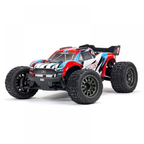 A red and blue Arrma 1/10 VORTEKS 3S 4X4 RTR Brushless Stadium Truck with oversized tires and a detailed body design
