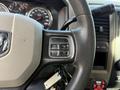 A 2012 Dodge Ram 5500 steering wheel with control buttons for cruise control including on off resume and set