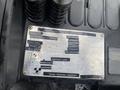 A metal identification plate from a 2011 Toyota 028FG15 forklift truck displaying model information specifications and load capacities