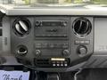 Dashboard of a 2016 Ford F-550 featuring controls for audio and climate with knobs and buttons