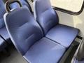 A pair of blue upholstered seats in a vehicle interior designed for comfort and durability