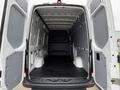 Interior view of a 2019 Mercedes-Benz Sprinter showing a spacious cargo area with a flat floor and high walls designed for storage or transport purposes