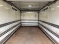 Interior view of a 2017 Kenworth T370 truck trailer showcasing a spacious empty cargo area with metal strips along the walls for securing loads