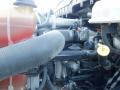 Close-up view of the engine components of a 2014 International Durastar including hoses valves and wiring