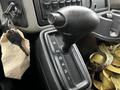 The gear shifter of a 2011 International DuraStar 4300 showing positions for reverse neutral and drive with an eco setting