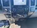 Interior dashboard controls of a 2019 Ford F-150 featuring audio and climate control buttons with a touchscreen display