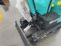 2024 AGT Industrial MH12R Mini Excavator showing track, arm, and bucket components with protective wrapping on the arm