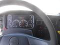 Dashboard of a 2005 Freightliner M2 106 Medium Duty featuring gauges for RPM speed and various indicators along with a steering wheel in the foreground