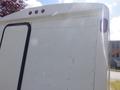 A 2004 Royal 18 Foot Office Trailer featuring a smooth white exterior with a black door and red taillights