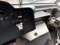 Dashboard of a 2012 Ford Econoline featuring various gauges switches and controls