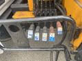 Close-up of control levers with colored buttons for hydraulic functions on a 2017 Ford F-550 vehicle
