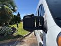 Side view mirror of a 2016 RAM Promaster showcasing its rectangular shape and black casing